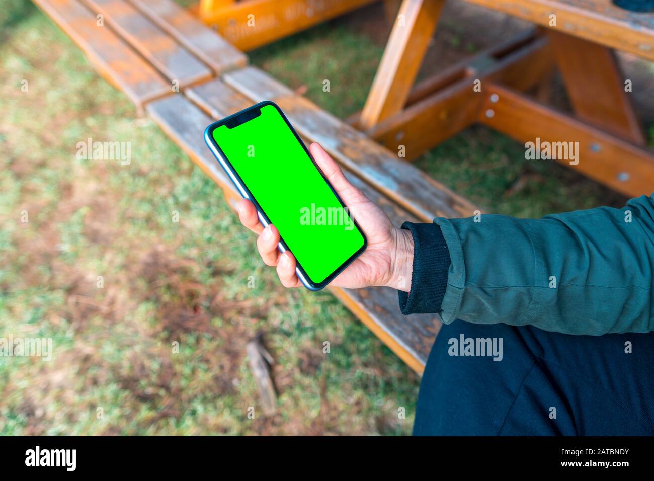 Mockup image of smart phone with green blank screen template, woman ...