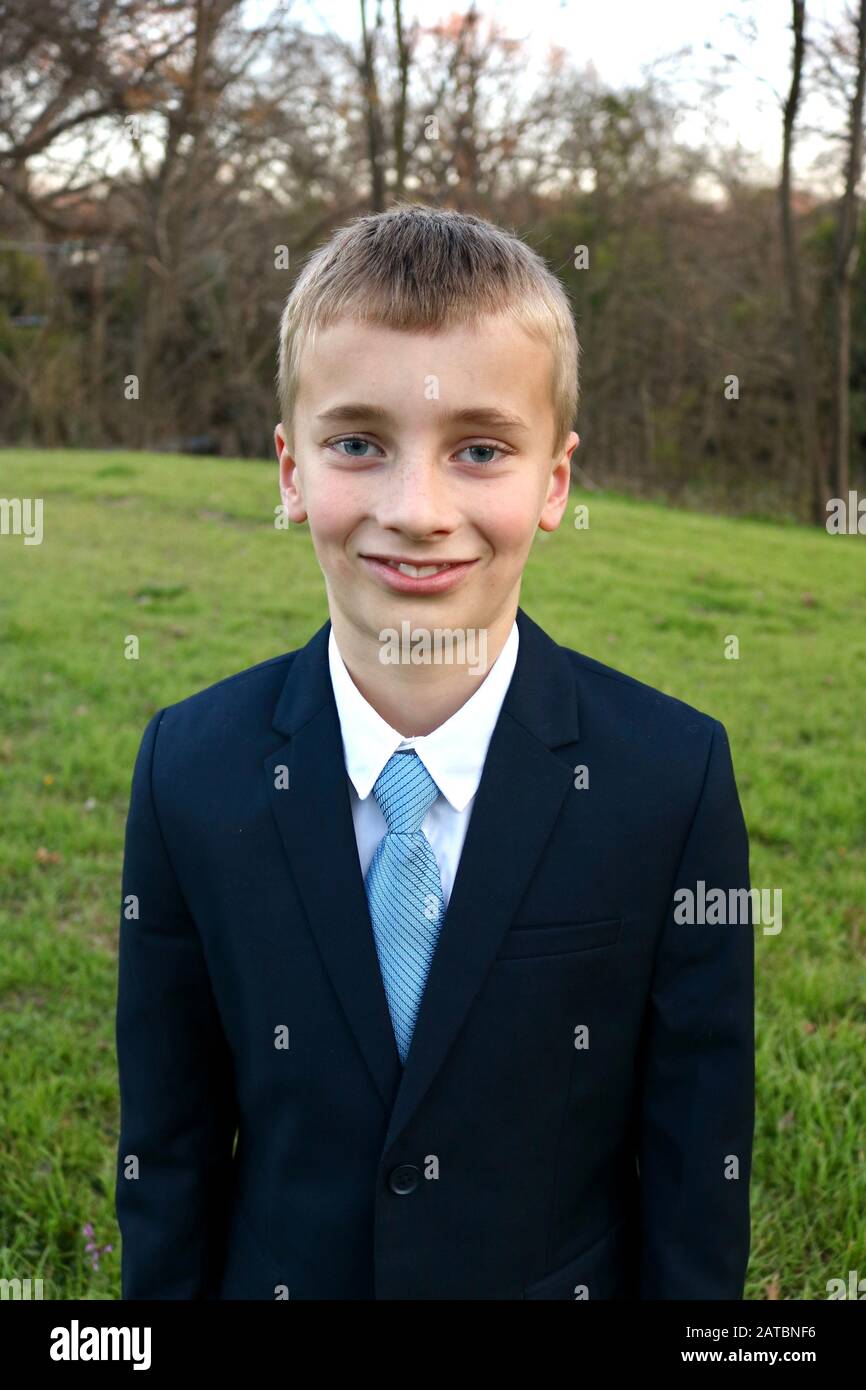 Portrait of a boy coming of age dressed in a sharp suit Stock Photo
