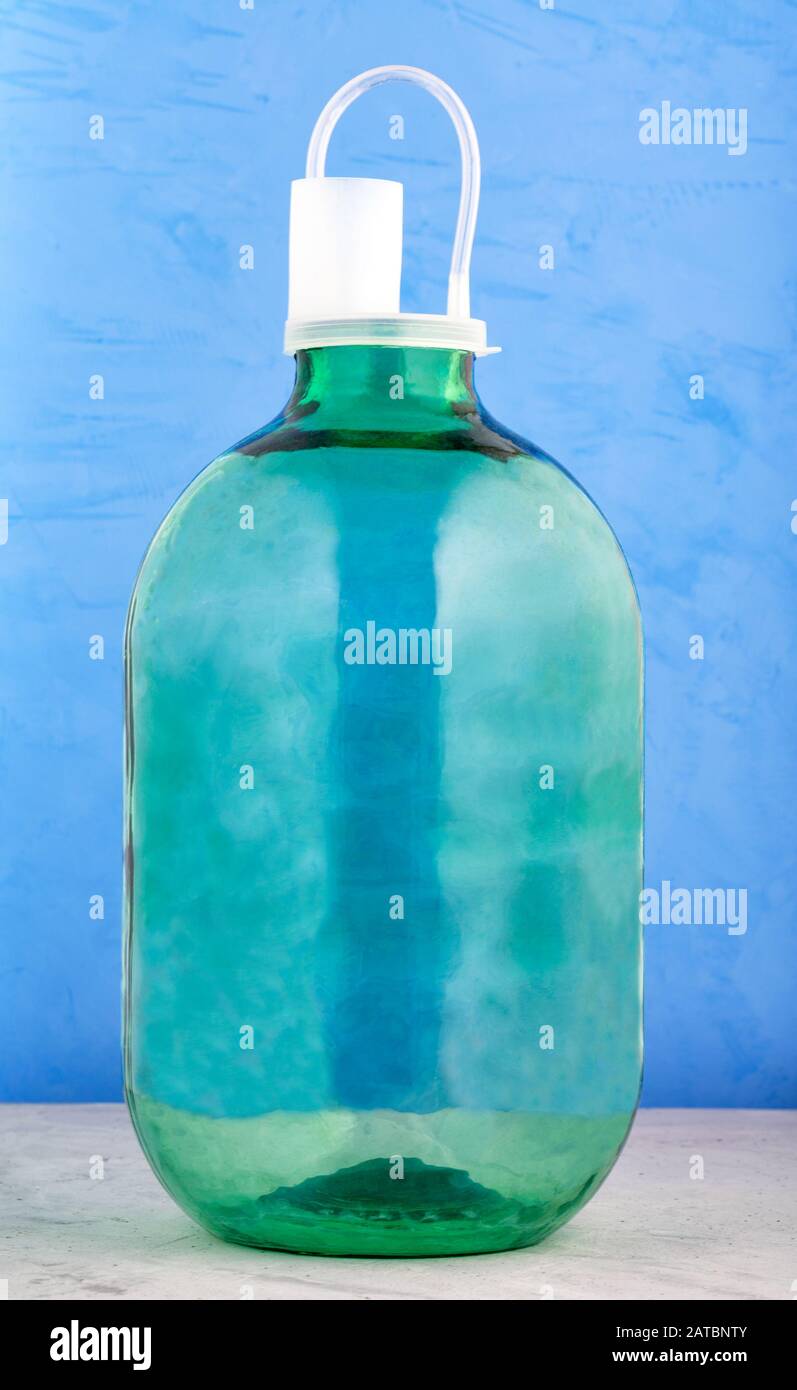 A 10 liter glass jar is made of thick green glass, a beautiful large
