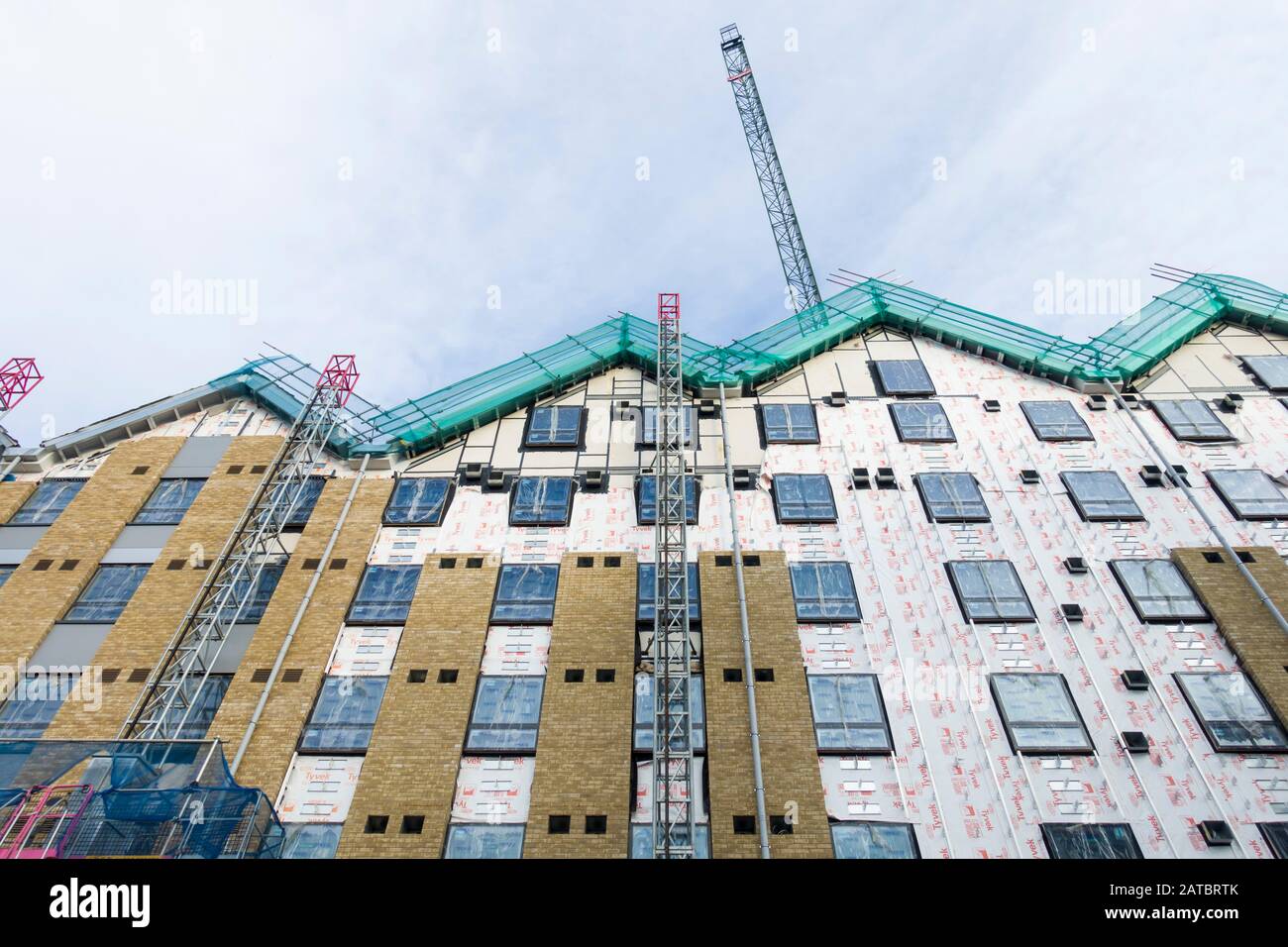 Contemporary flats under construction in Exeter, Devon, UK, with insulation and façade cladding