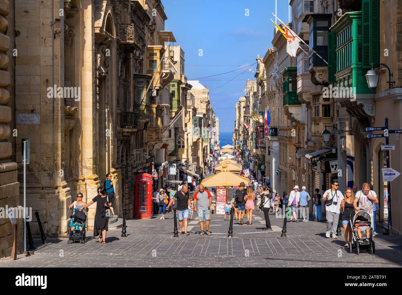 Valletta, Malta - October 13, 2019: Merchants Street in capital city, lively shopping pedestrian boulevard full of tourists and locals, stalls, stores Stock Photo
