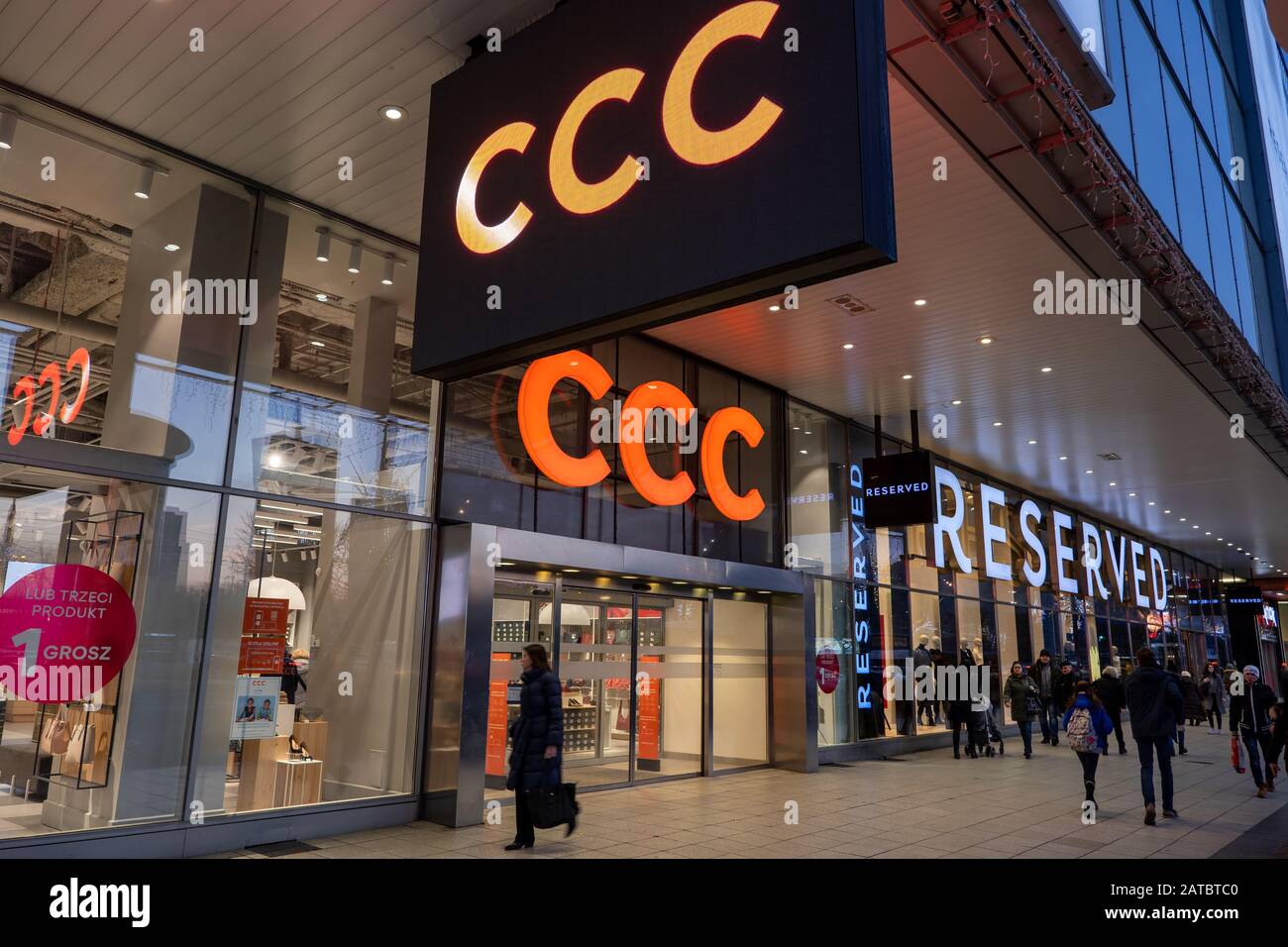 Warsaw, Poland - January 14, 2019: CCC shoes and bags and Reserved clothing store in the city center at night Stock Photo