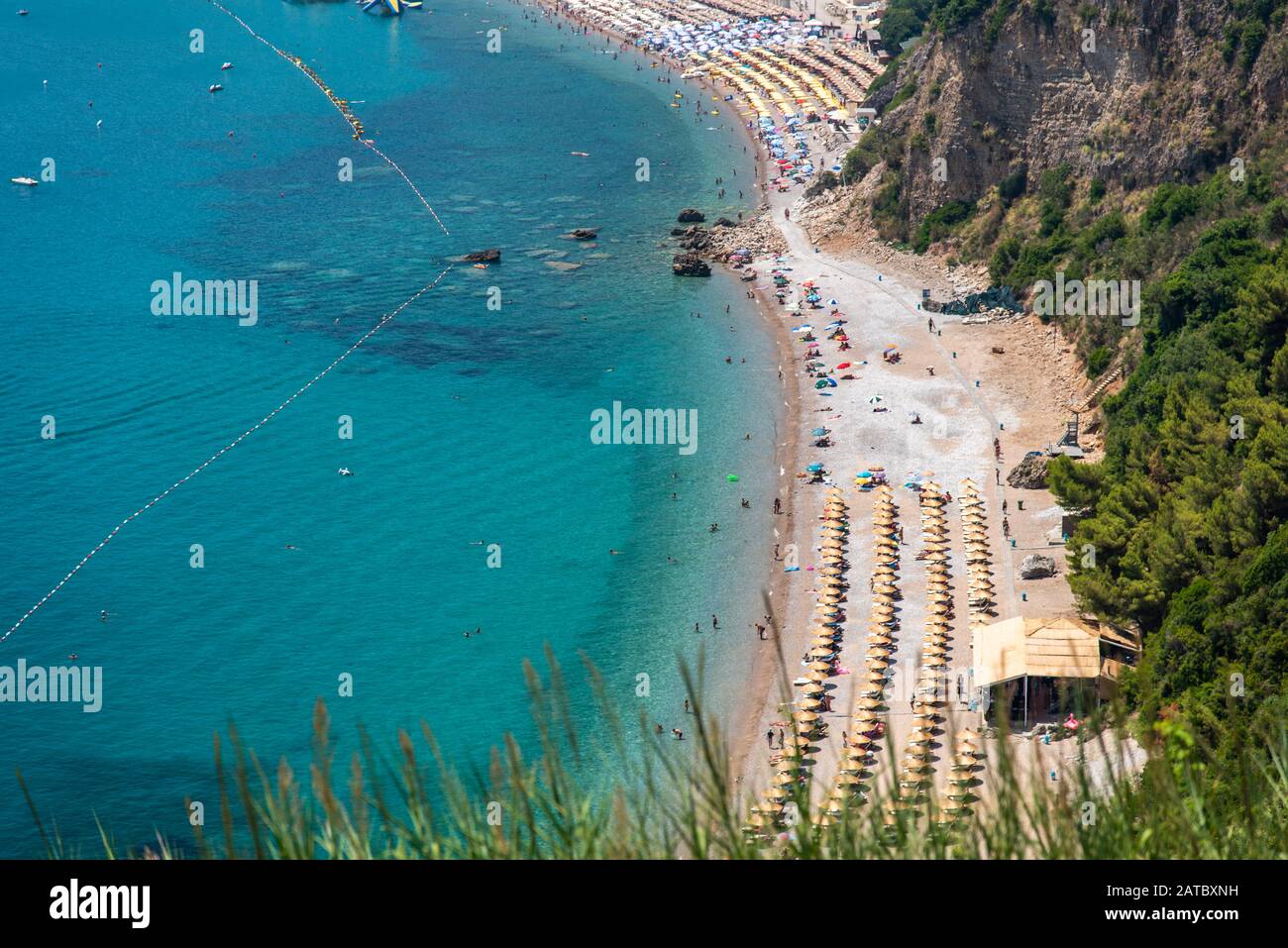 Panoramic view of the largest beach with many people in lagoon in Przno. Adriatic Seacoast, Przno Beach, Milocer, Montenegro Stock Photo