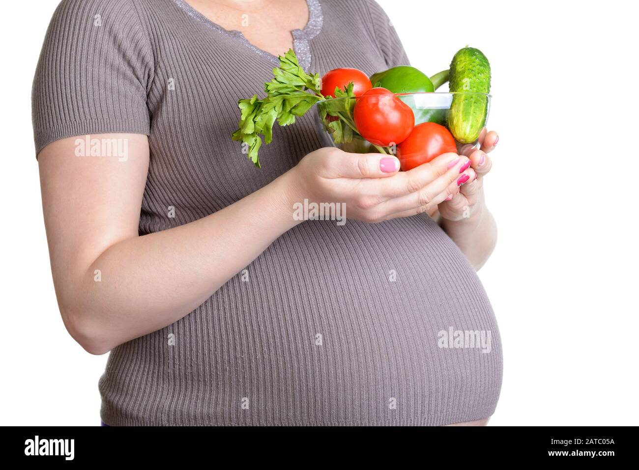 Pregnant woman with fresh vegetables isolated on white background Stock ...
