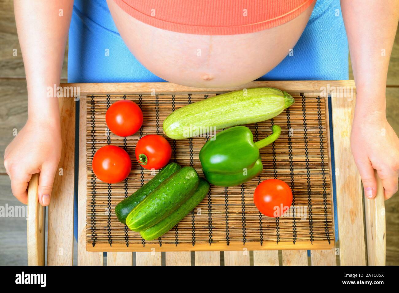 Pregnant woman with vegetables Stock Photo - Alamy
