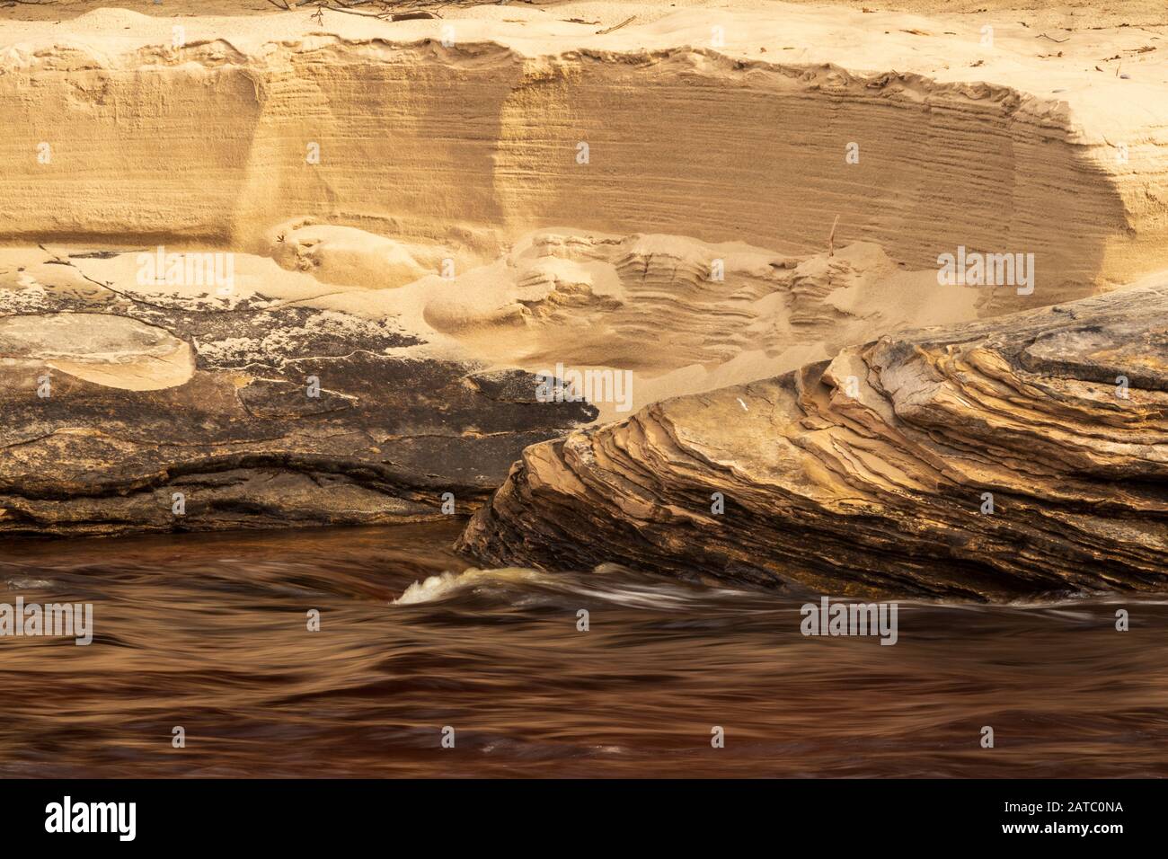 Wave Erosion Carved Rocks at Miner's Beach Stock Photo - Alamy