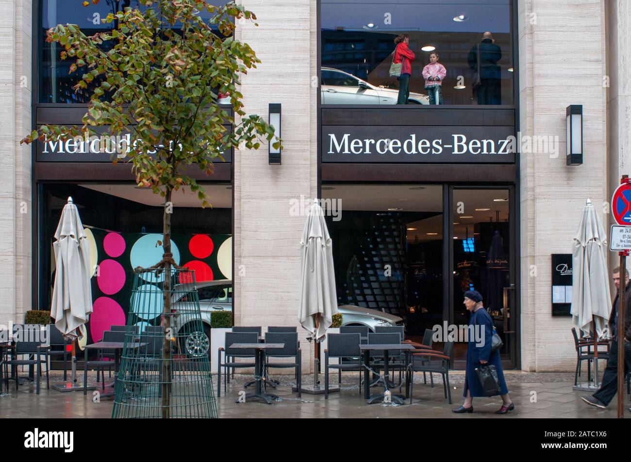 Berlin Mercedes Benz motor car showroom, Outlet selling luxury cars and 'Berlin moves' slogan in Unter den Linden in Berlin Germany Stock Photo