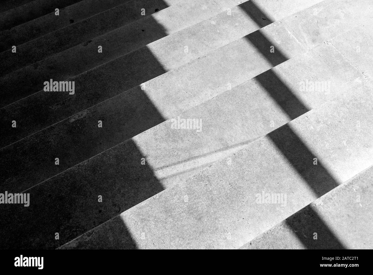 Concrete steps and shadows pattern, abstract in black & white of shadows on concrete steps. Stock Photo