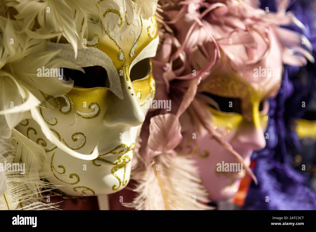 Traditional venetian masks in Venice, Italy. Venetian carnival is an annual costume festival, which attracts many tourists. Stock Photo