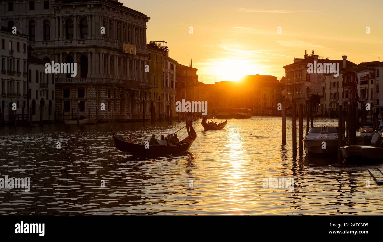 Grand Canal with gondolas at sunset in Venice, Italy. Grand Canal is ...