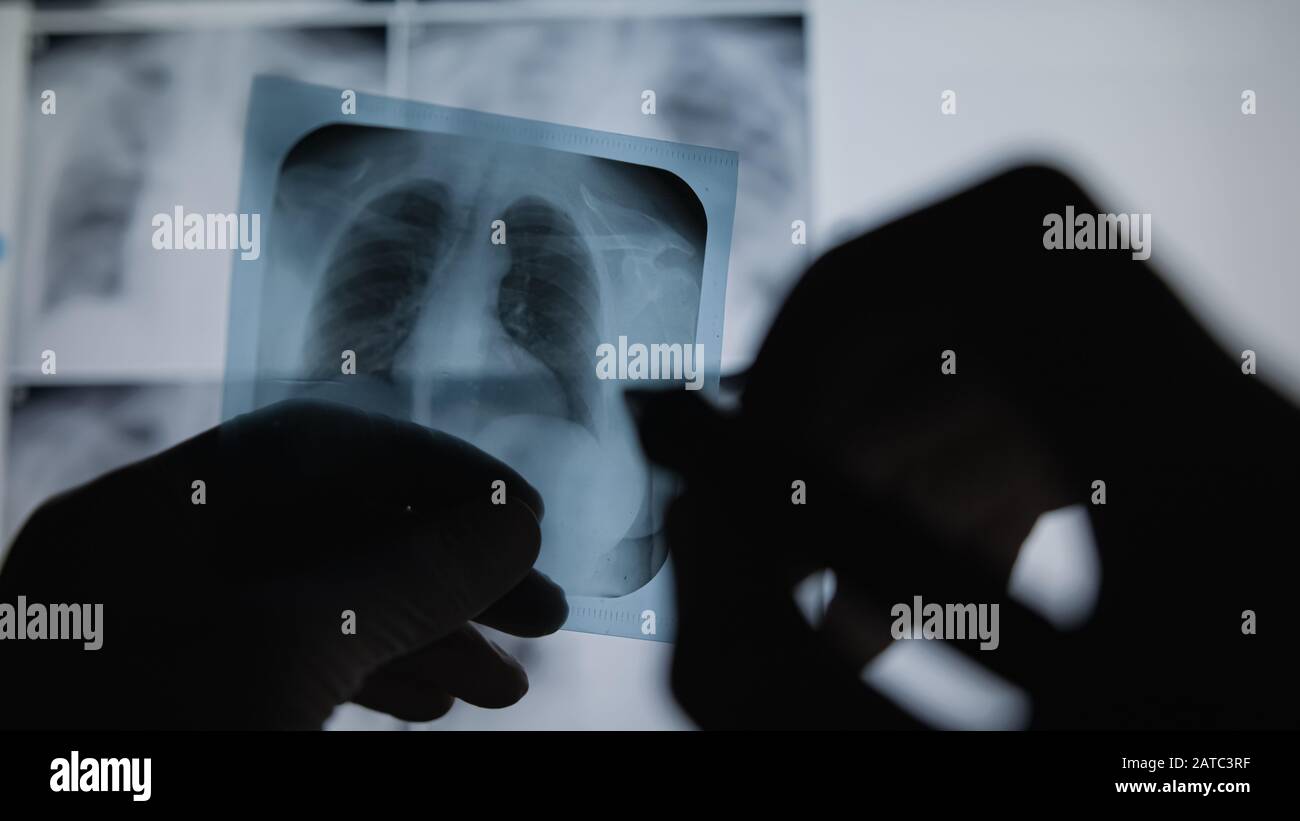 Professional medical team examining a patient's radiography, Medical Concept. Stock Photo