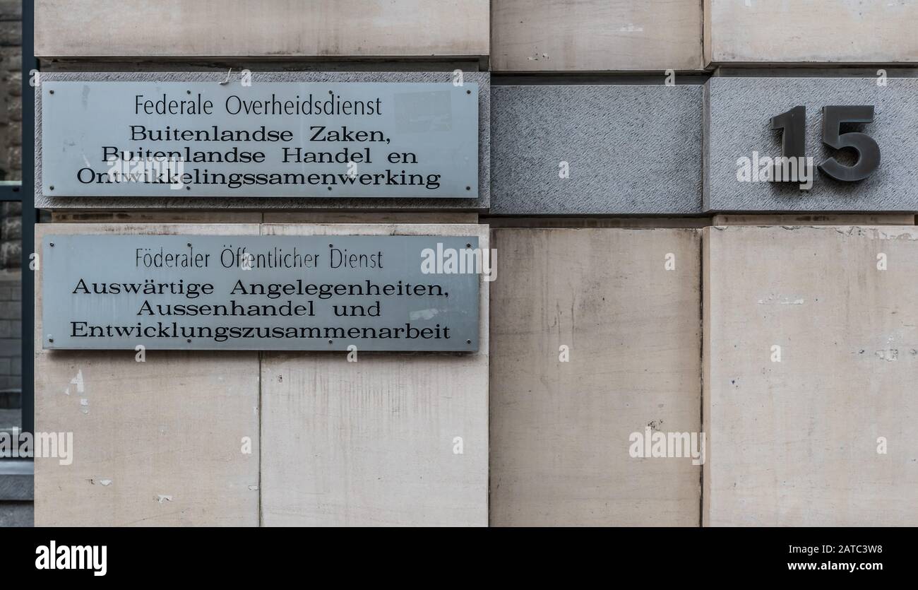Brussels Old Town, Brussels Capital Region / Belgium - 12 20 2019: Embossed silver signs in four languages at the entrance of the Federal Public Servi Stock Photo