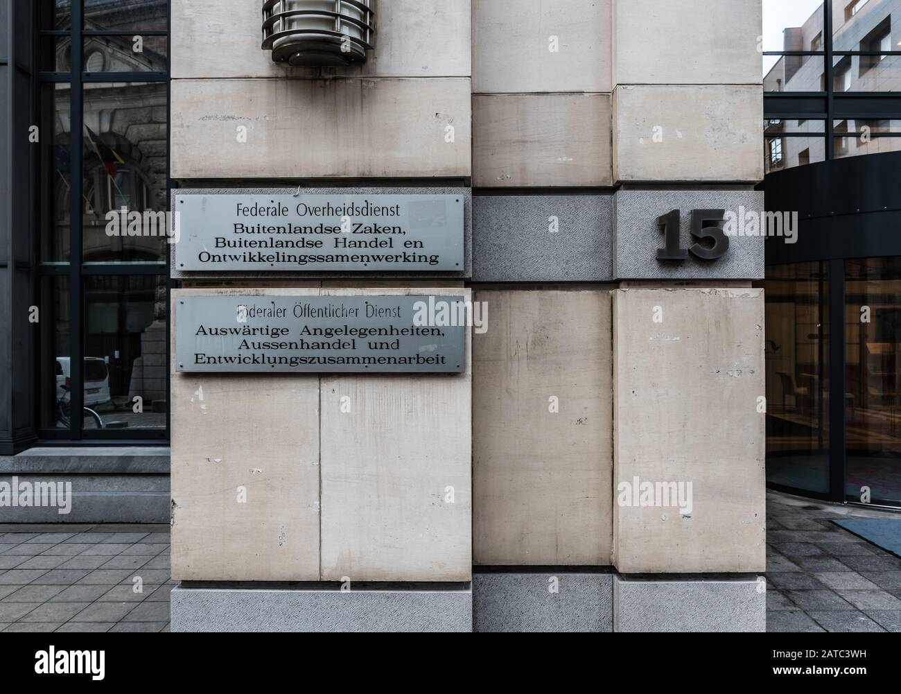 Brussels Old Town, Brussels Capital Region / Belgium - 12 20 2019: Embossed silver signs in four languages at the entrance of the Federal Public Servi Stock Photo