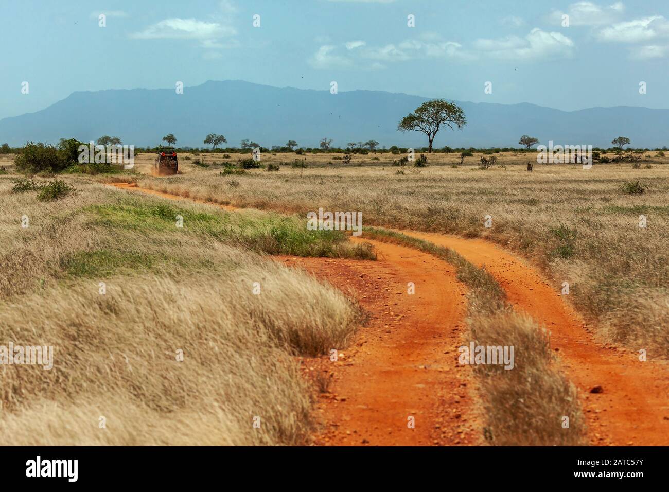 Red dry mud road in Kenya National Park (Tsavo East Stock Photo Alamy