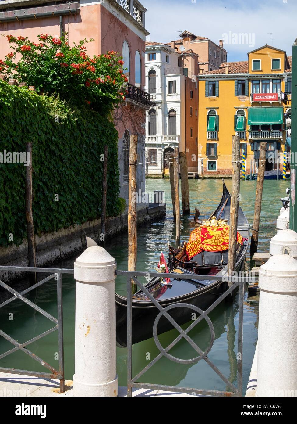 Gondola docked in a small canal in Venice Stock Photo
