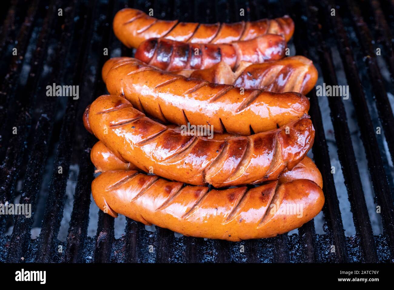 Juicy sausages grilled on the bbq Stock Photo