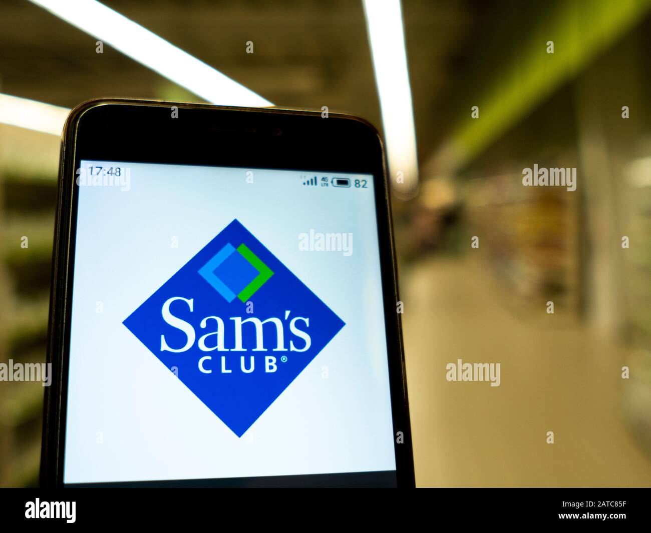 In this photo illustration the Sam’s club logo is seen displayed on a smartphone. Stock Photo