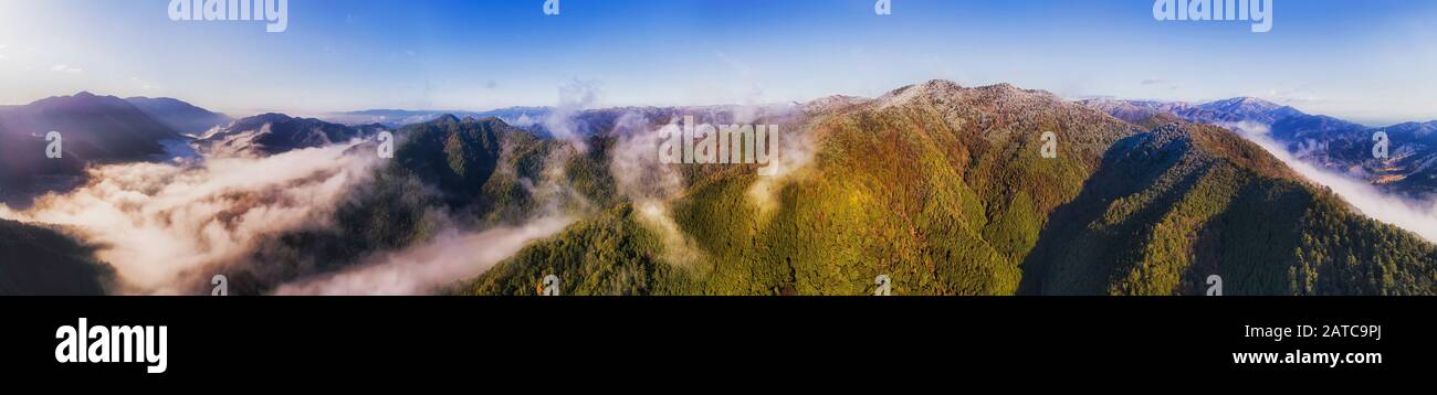 WInter season in high mountains around Kyoto city of Japan. Elevated aerial panorama over mountain ranges and valleys hidden under morning fog and clo Stock Photo