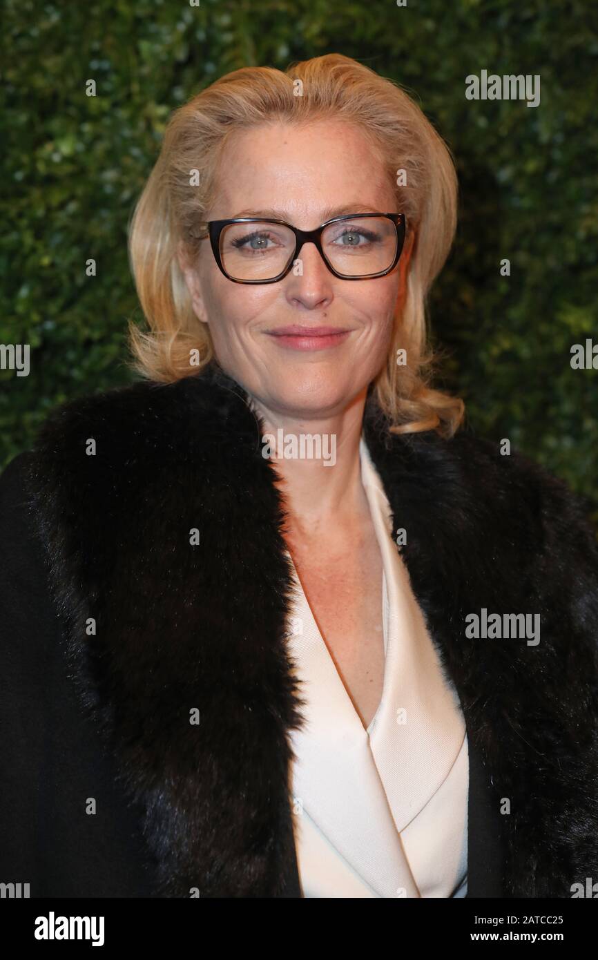 Gillian Anderson arriving at the Charles Finch and Chanel pre-Bafta party  at 5 Hertford Street in Mayfair, London Stock Photo - Alamy