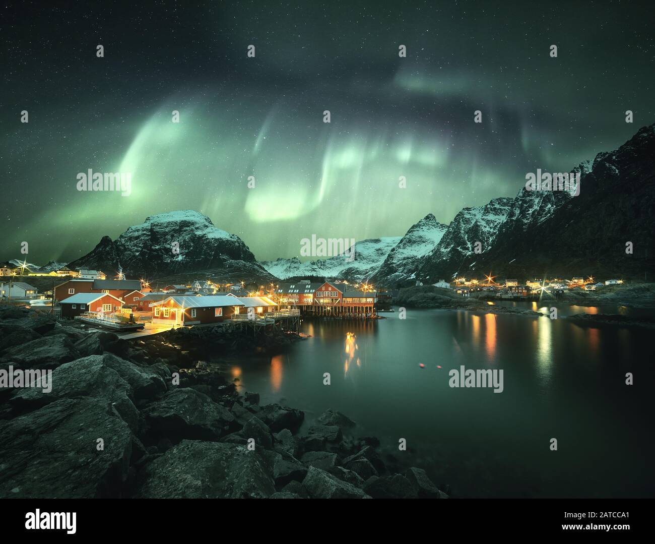 Northern lights over a coastal village, Lofoten, Nordland, Norway Stock Photo