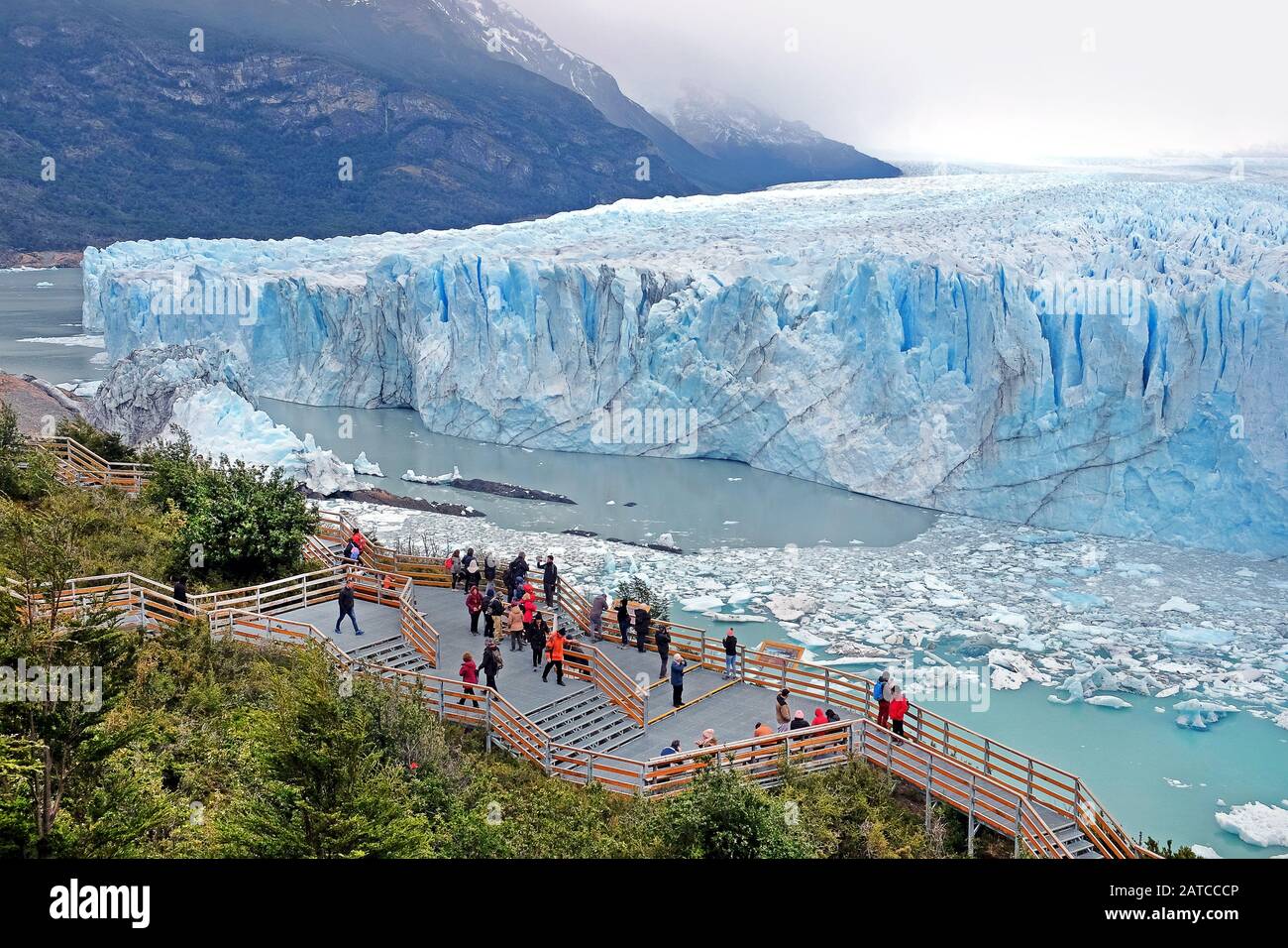 Panoramic view of Perito Moreno Glacier, in El Calafate, Argentina, against a grey and cloudy sky. Stock Photo