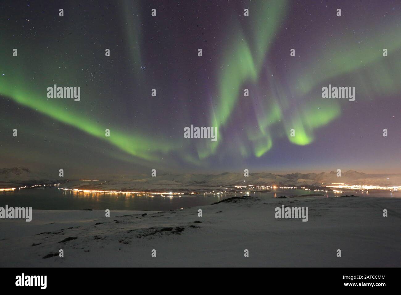 Northern Lights Over Winter Mountains Stock Photo