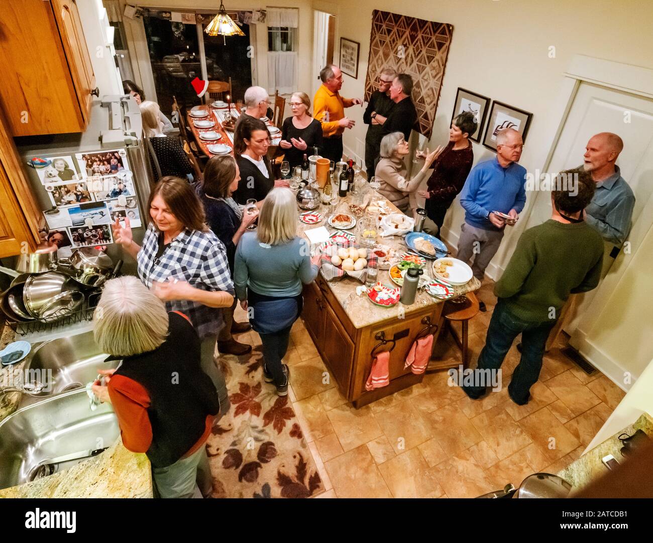 Friends gather in residential home for Christmas holiday party Stock ...