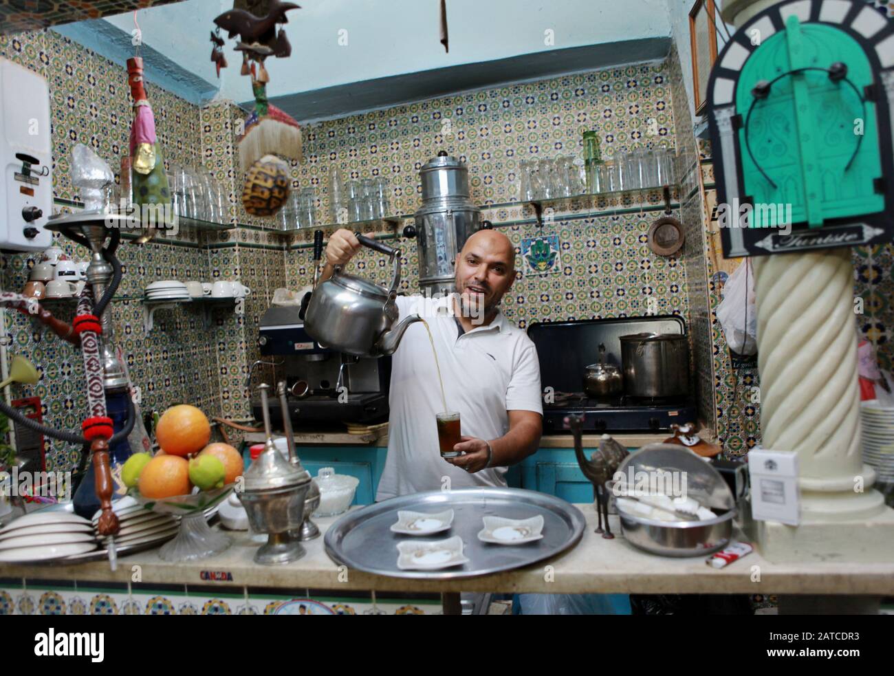 Chef prepairing mint tea at le Petit Cafe Maure in Medina of Sousse. Stock Photo