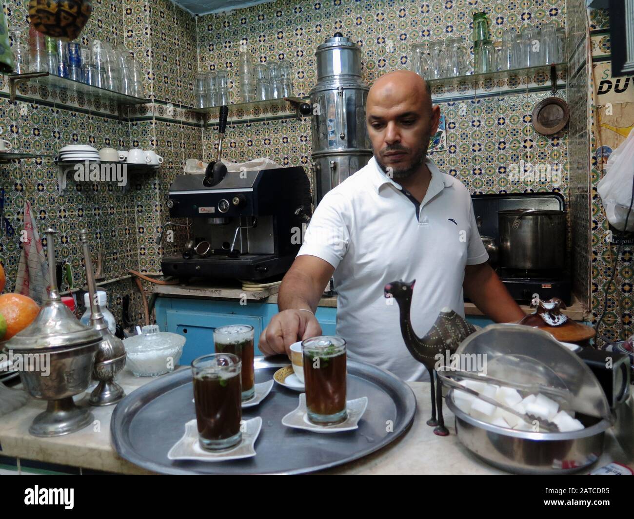 Chef prepairing mint tea at le Petit Cafe Maure in Medina of Sousse. Stock Photo