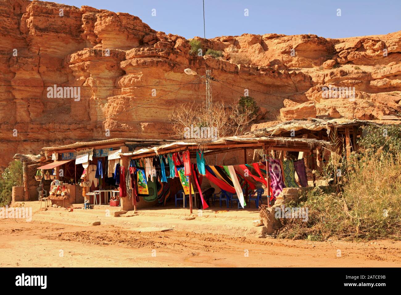 Colorful cloths wave in the breeze in the shops of Tamerza Canyon Stock Photo