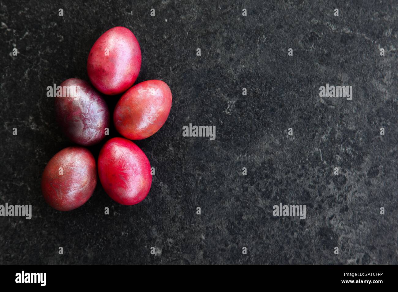 Marbled Easter eggs on black plate Stock Photo
