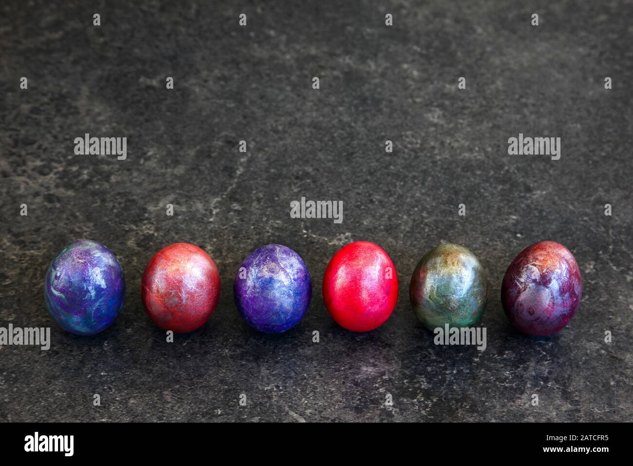 Colored Easter eggs on dark background Stock Photo