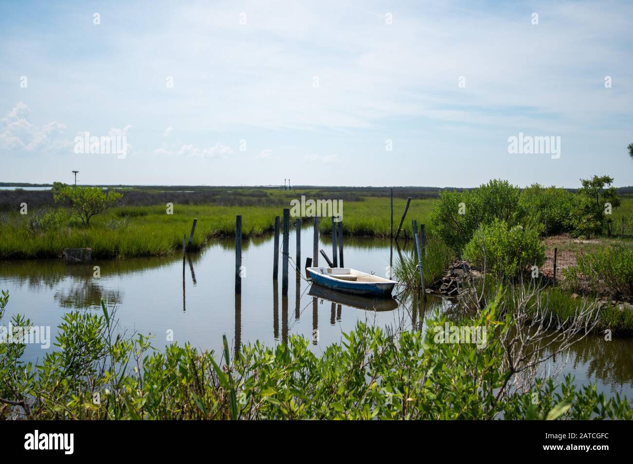 Small boat moored in the wetlands of Tangier Island, Virginia. Stock Photo