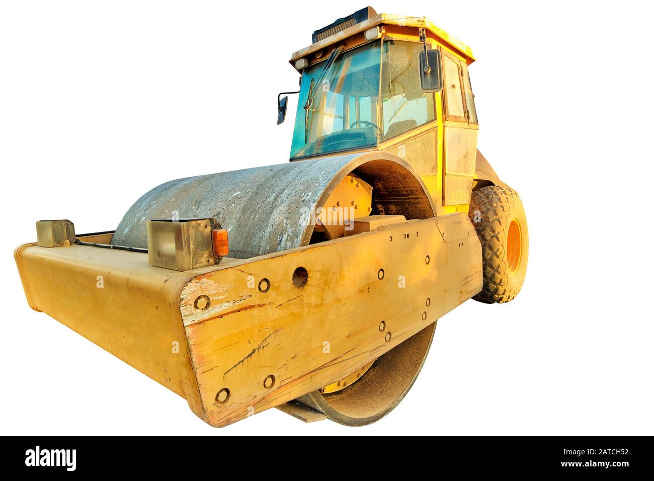 Closeup of steamroller isolated on white background with copy space. Concept of work in progress. Stock Photo