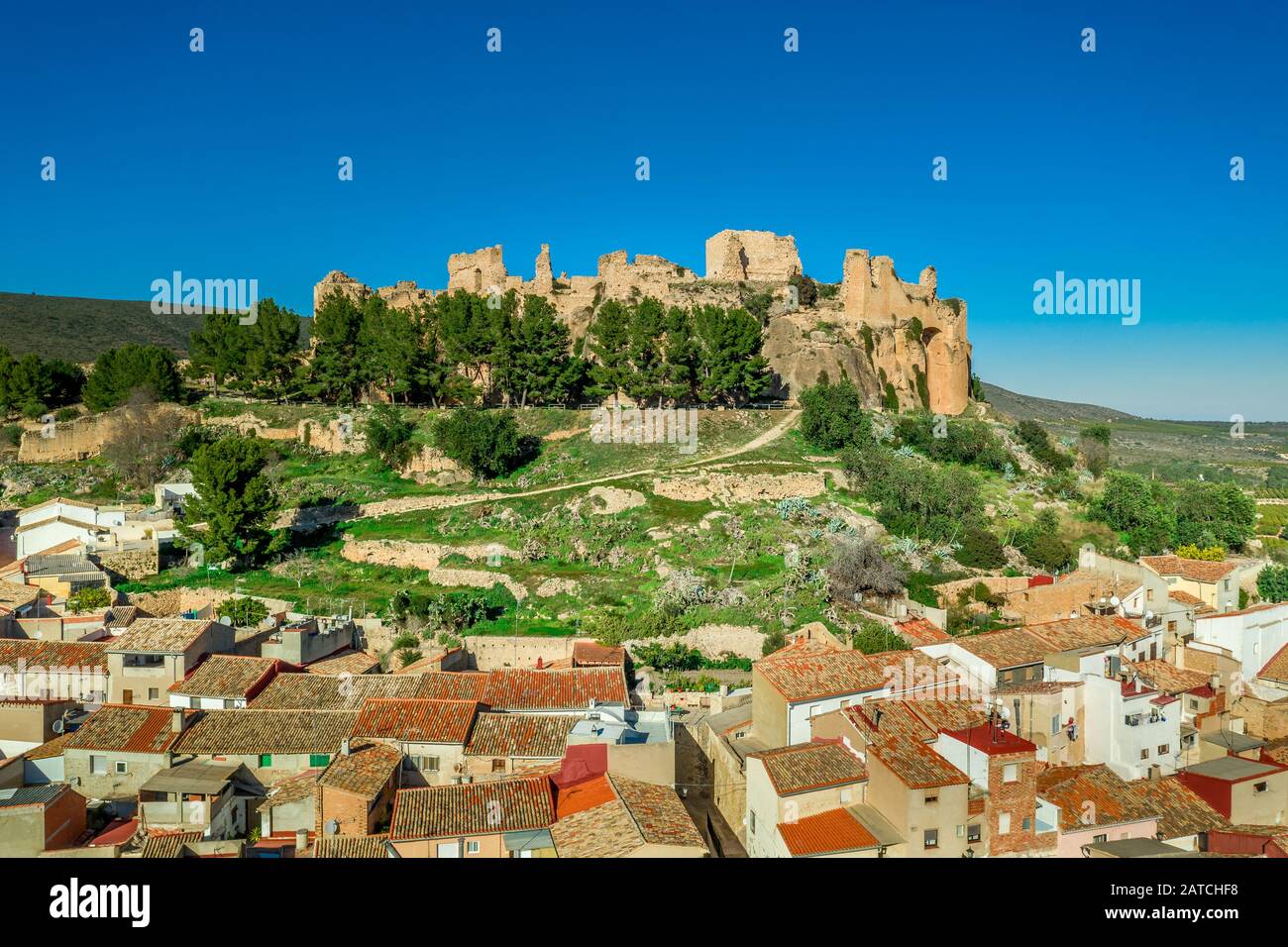 Aerial view of medieval ruined Montesa castle center of the Templar and Montesa order knights with donjon, long ramp to the castle gate in Spain Stock Photo