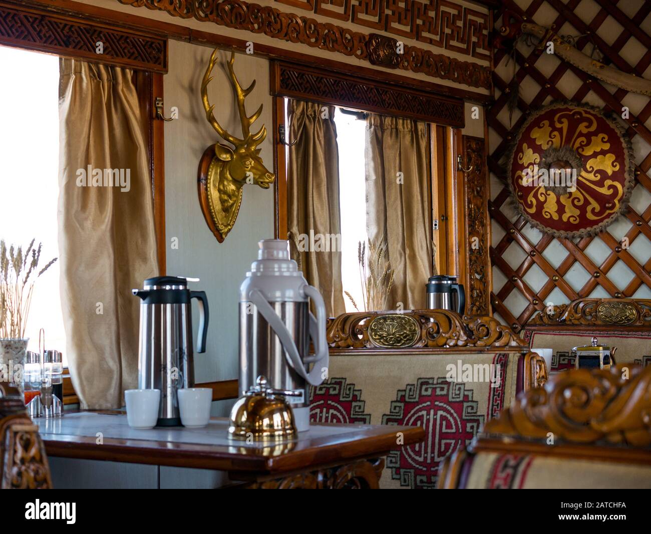 Interior of traditionally decorated Trans-Mongolian Express train dining carriage, Mongolia, Asia Stock Photo