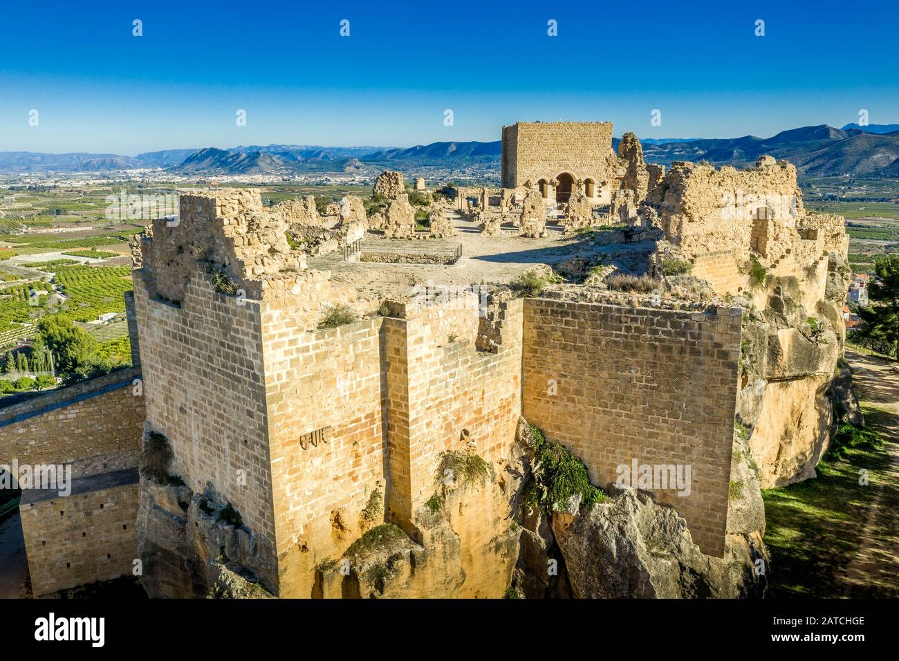 Aerial view of medieval ruined Montesa castle center of the Templar and Montesa order knights with donjon, long ramp to the castle gate in Spain Stock Photo