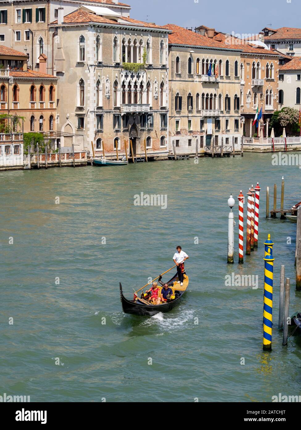 Tourists in a gondola in Venice Grand Canal Stock Photo