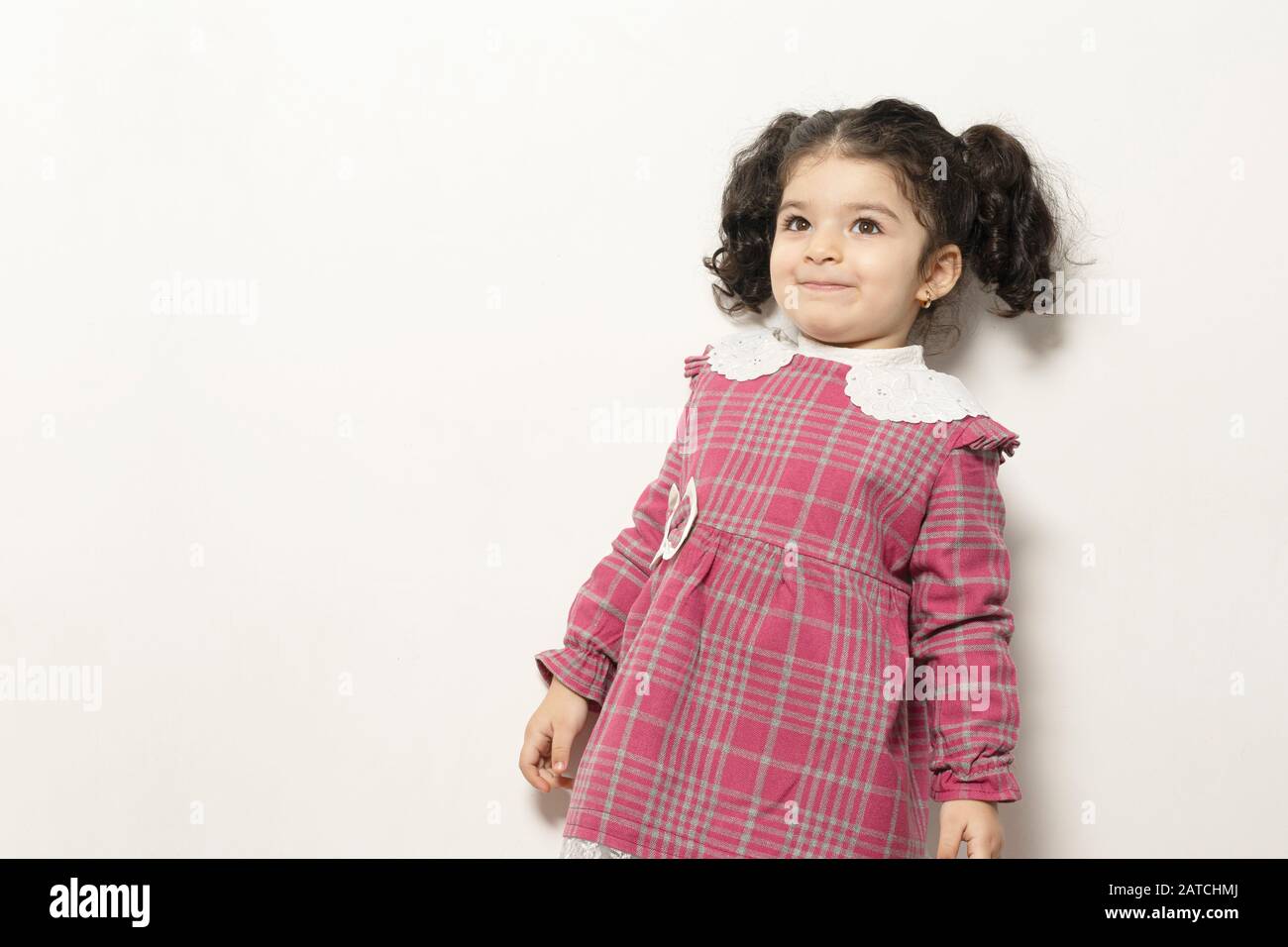 Little Girl With Two Parts Side Pony Hairstyle With Happy