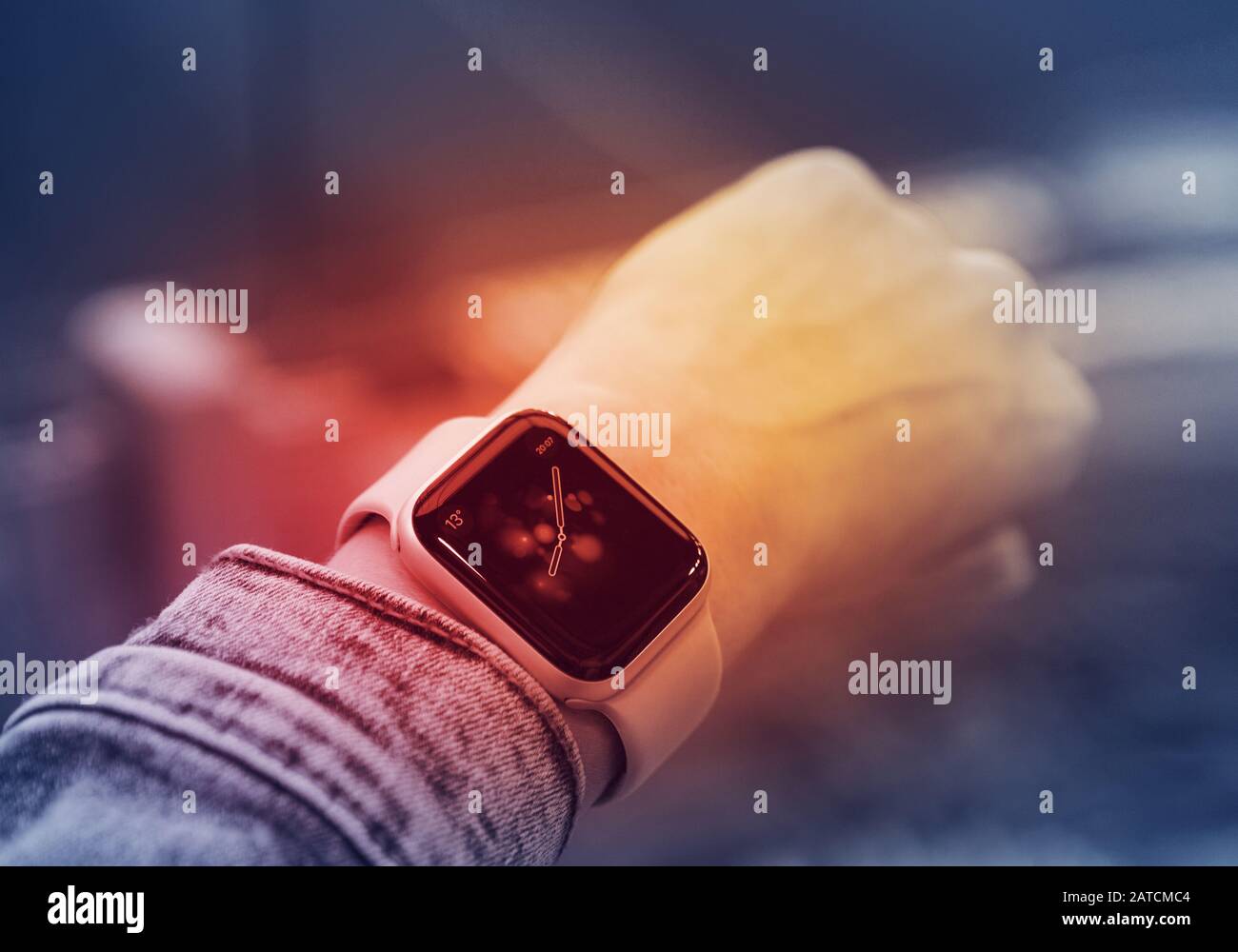Smart watch on a girl's hand on a lit red background, the concept of health  and modern technology Stock Photo - Alamy
