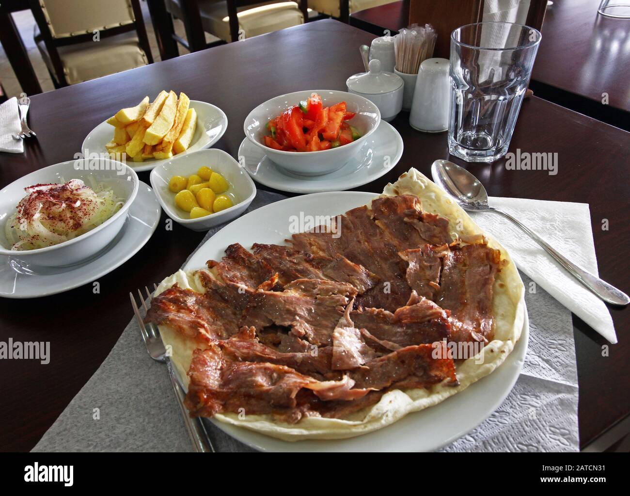 Turkish Doner Kebab with appetizer food in restaurant table Stock Photo ...
