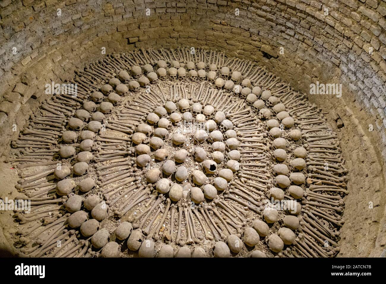 Human remains, skulls and bones arranged geometrically in a crypt, San Francisco Monastery and Church Catacombs, Lima, Peru Stock Photo