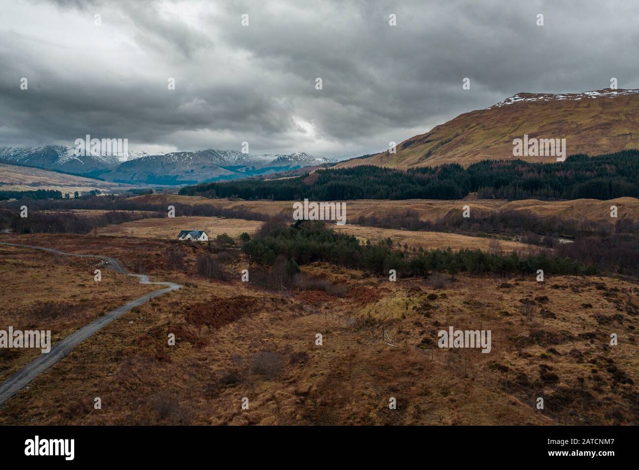 Snowy mountain range in Scottish Highlands at winter - drone point of view Stock Photo