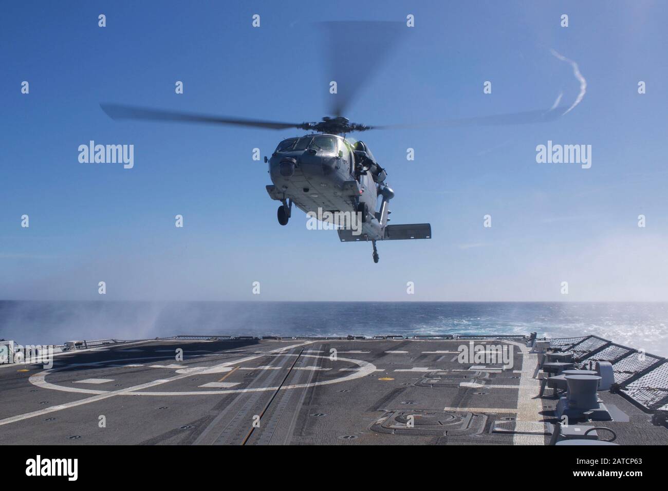 200130-N-FP334-0041   PACIFIC OCEAN (Jan. 30, 2020) A MH-60S Seahawk helicopter, from the 'Indians' of Helicopter Sea Combat Squadron (HSC) 6, prepares to land on the flight deck aboard the guided-missile destroyer USS Ralph Johnson (DDG 114). Ralph Johnson is currently underway conducting routine operations. (U.S. Navy photo by Mass Communication Specialist 3rd Class Anthony Collier) Stock Photo