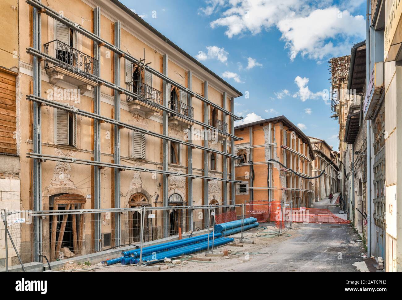 Buildings damaged in 2009 L'Aquila Earthquake, protected by metal beams, 2018 view, Piazza Duomo, L'Aquila, Abruzzo, Italy Stock Photo