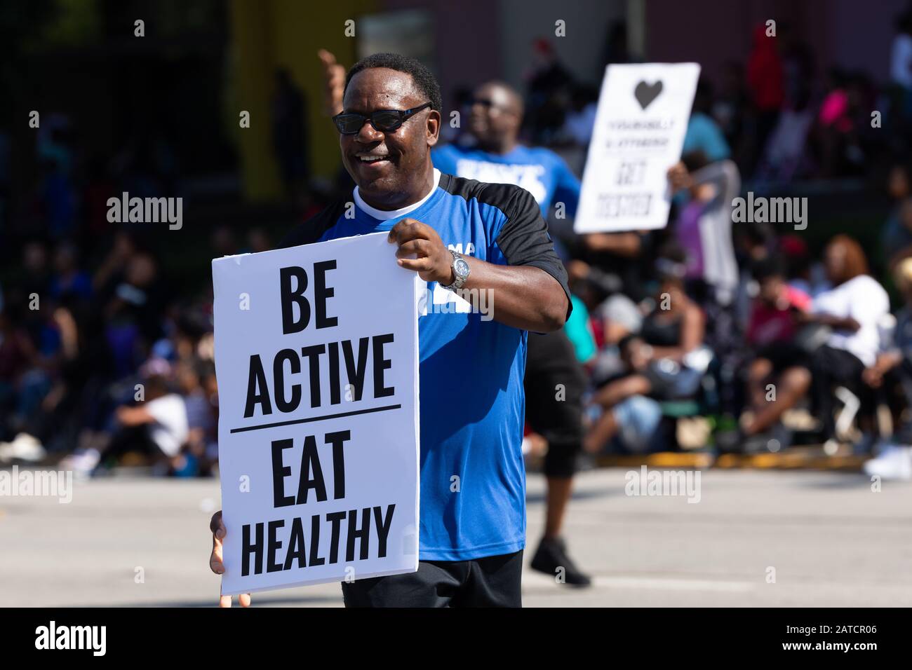 Indianapolis, Indiana, USA - September 28, 2019: The Circle City Classic Parade, Men carrying signs promoting healthy life styles Stock Photo