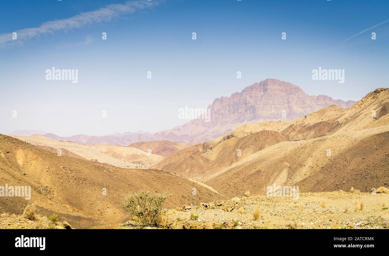 Barren landscape of Hajar mountains in Oman Stock Photo