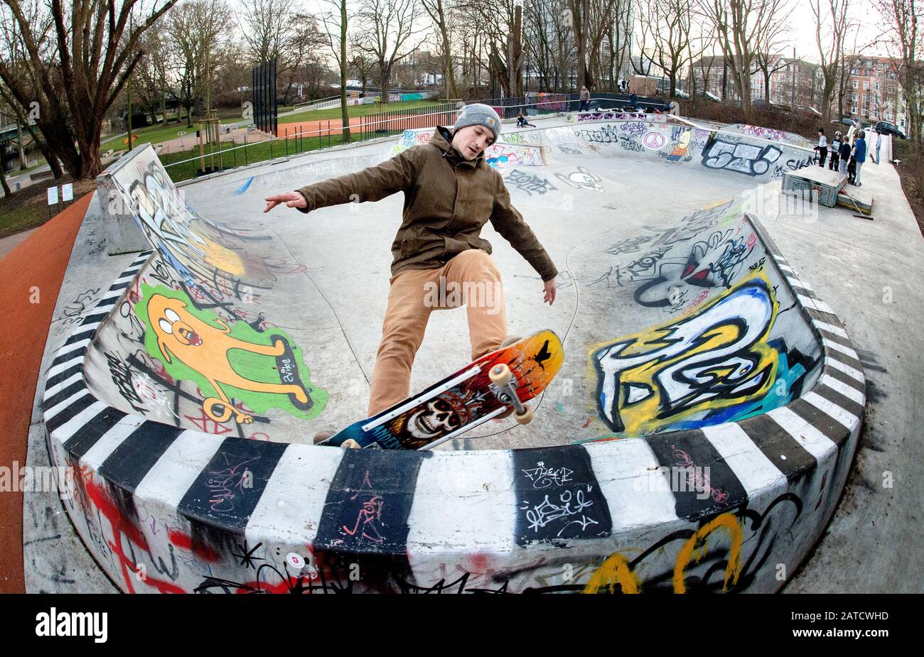 Hanover, Germany. 23rd Jan, 2020. Sebastian rides his skateboard on a  skatepark in the district of Linden, which was built by the company Yamato  Living Ramps (shot with fisheye lens). The Hanover-based