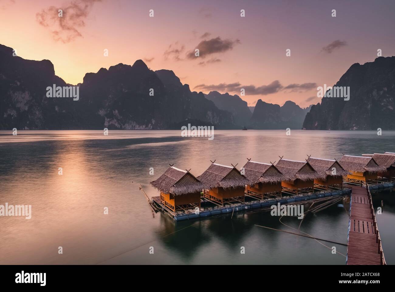 Beautiful sunset over the raft houses on Cheow Lan lake, Thailand.  Stock Photo