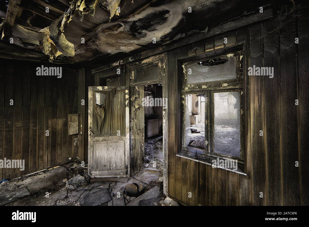 Inside shot of an abandoned destroyed building with burned walls and